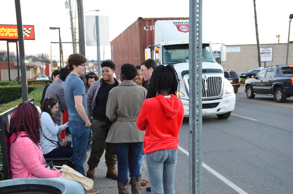 Image of students bunched around a bus stop in Nashville, Tennessee