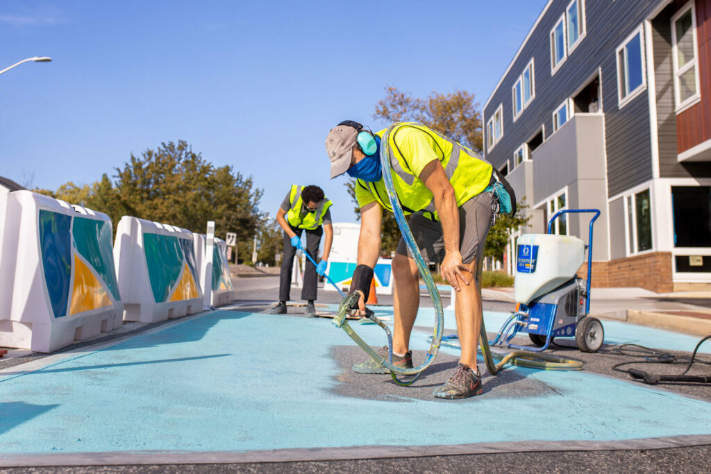 painting a street as part of a creative sidewalk extension