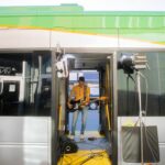 Image of musician performing inside of bus