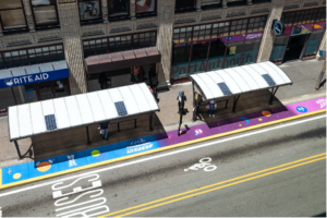 bird's eye view of two bus stops with paint between them and curb